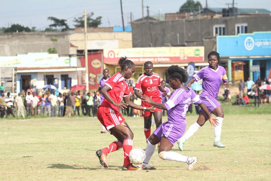 UCU's Hasifa Nasssuna(Purple) and She Corporates Nambirige Christine in action during the match