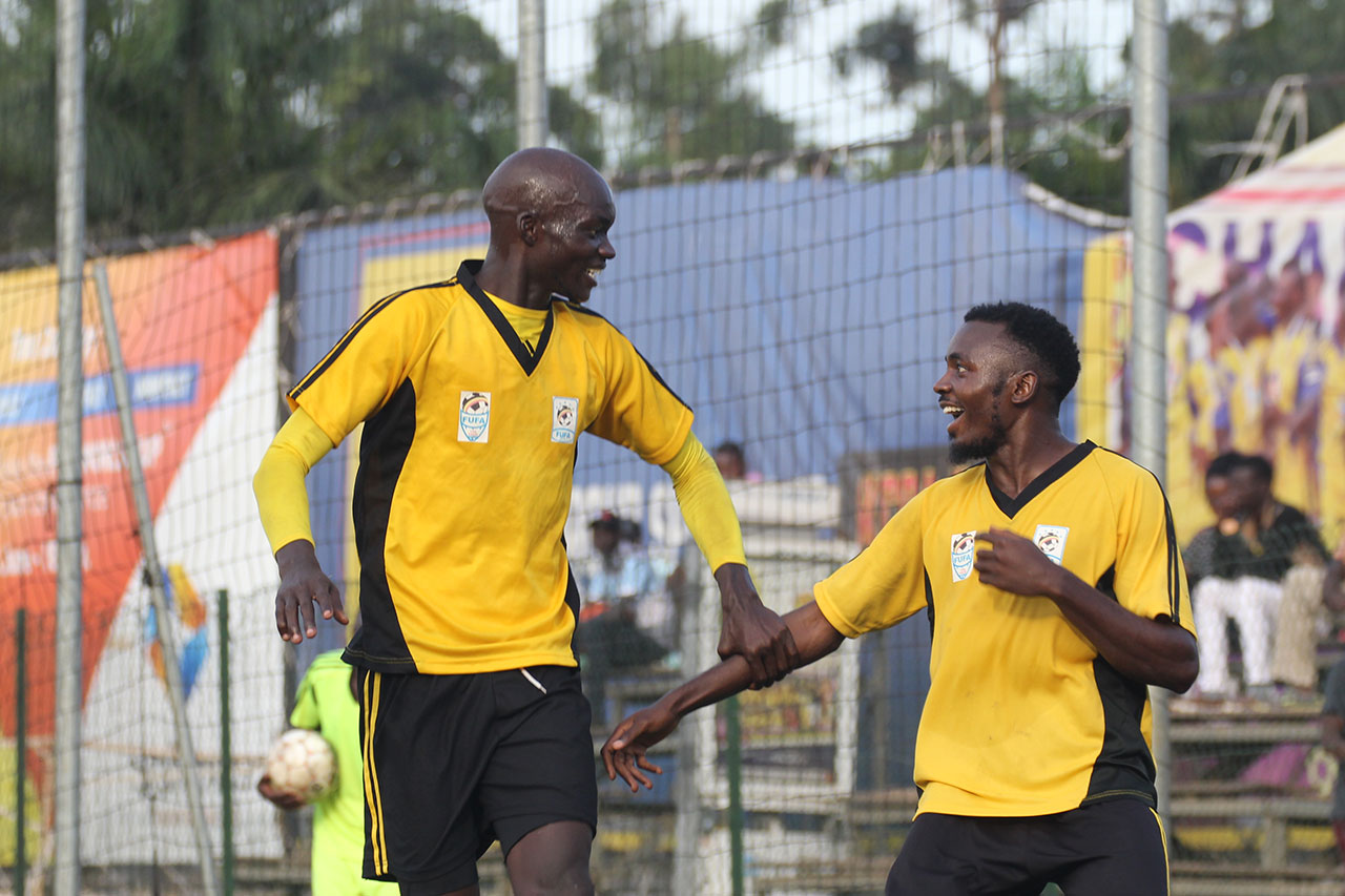 Bugisu's FUFA Drum leading scorere James Alitho (L) celebrates with Muwada Mawejje 